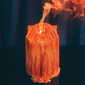 Cover image of the album Playing Favorites, showing a Sheer Mag candle melting from its flame.